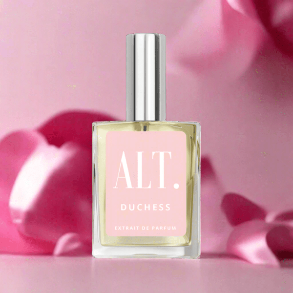 A bottle of perfume sitting on top of pink flowers.