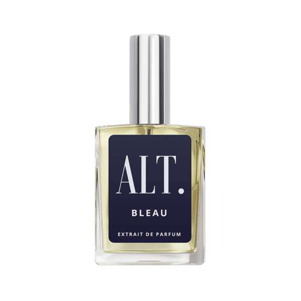 A bottle of perfume on a green background