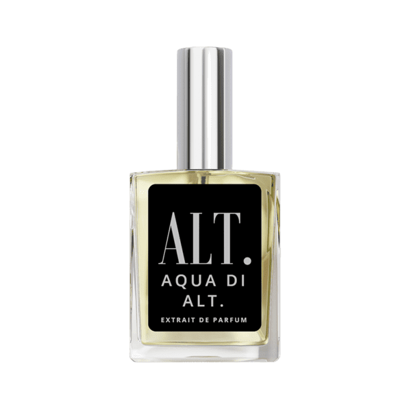 A bottle of perfume on top of a green background.