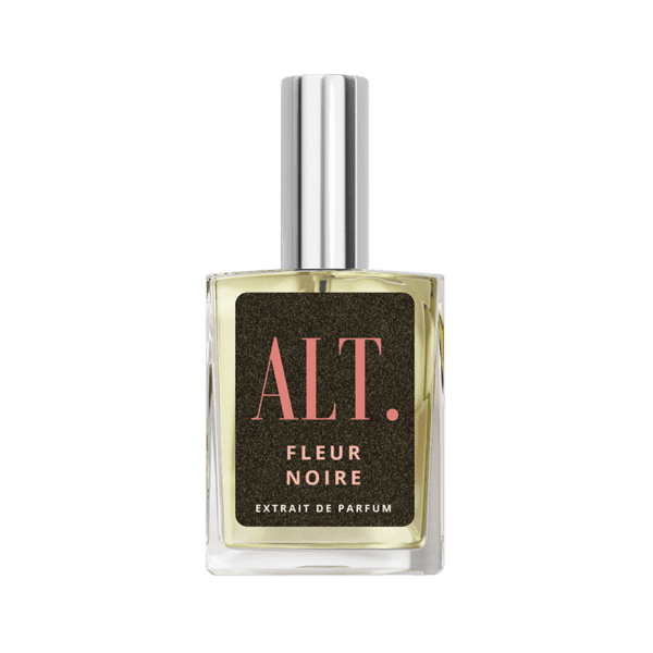 A bottle of perfume on a green background