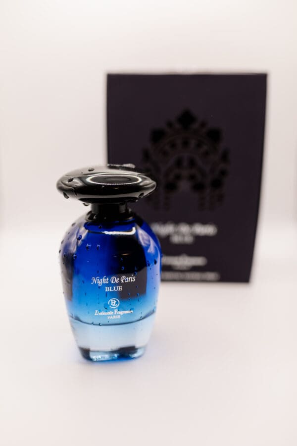 Blue perfume bottle with droplet details.