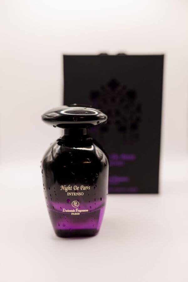 Black perfume bottle with purple accents.