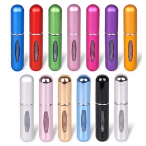 Colorful travel-size perfume atomizer bottles arrangement.